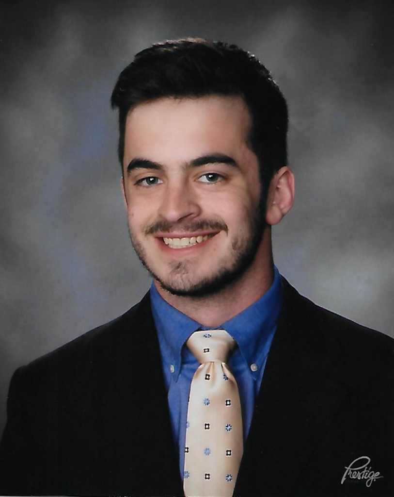 Smiling young man portrait in suit and tie